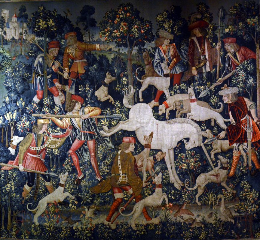 New York Cloisters 57 017 Unicorn Tapestries - The Unicorn Defends Itself - the injured unicorn is held at bay by 3 hunters ready to pierce him with their lances